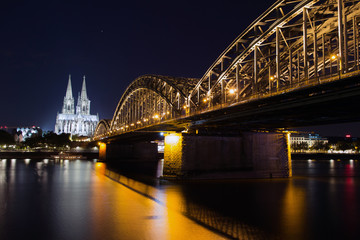 Fototapeta premium Bridge and the Dom of Cologne at night. Cologne, Germany. october 2018