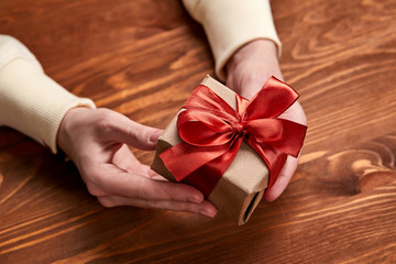 hands holding craft gift box