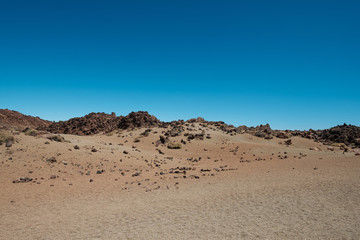 desert landscape -  sand, rocks and clear blue sky copy space 