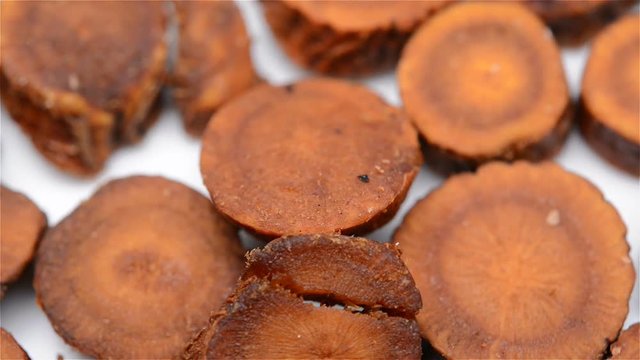 Chinese herb medicine of Glycyrrhiza uralensis or Licorice rotating close up