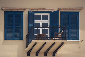 Beautiful balcony with blue shutters