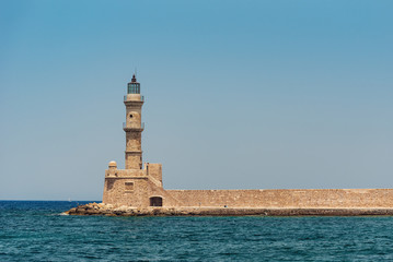 Chania Bay with sea water and a lighthouse on a sunny summer morning, Crete Greece, toned