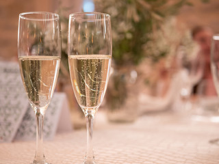 Two glasses with champagne in wedding table