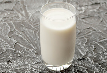glass of milk on a dark background