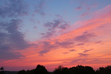 Beautiful fiery pink sunset background over the city