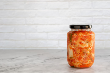 homemade cabbage kimchi in a glass jar - obrazy, fototapety, plakaty