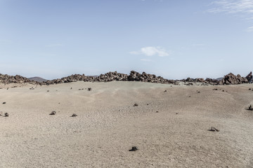 Fototapeta na wymiar Teide national park area conformed by rocky areas and sand on a sunny day, Tenerife island