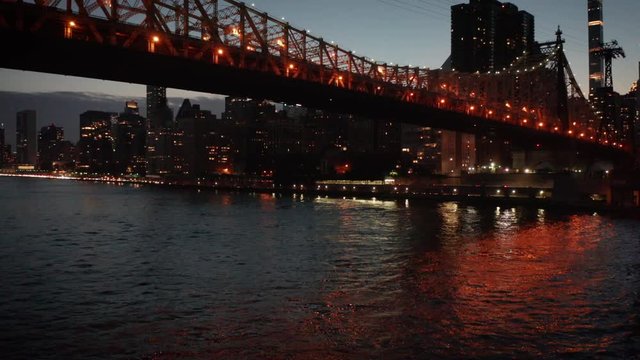 dusk rising shot of Queensboro Bridge and Manhattan