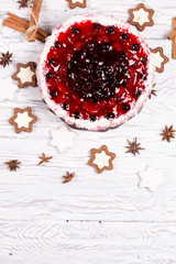 Sweet cake with cherry jelly, tasty and fresh on a white shabby wooden table