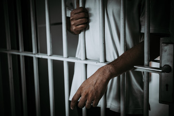 Hands of men desperate to catch the iron prison,prisoner concept,thailand people,Hope to be free.