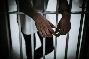 Hands of men desperate to catch the iron prison,prisoner concept,thailand people,Hope to be free.