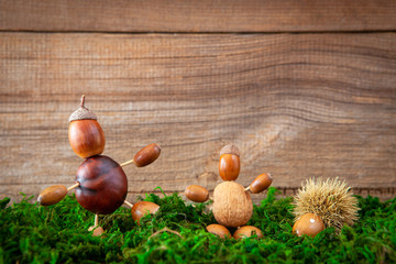 autumn tinker figures on wooden background