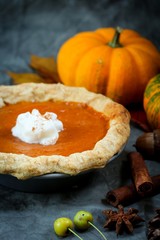 Homemade Pumpkin Pie on Autumn Thanksgiving background