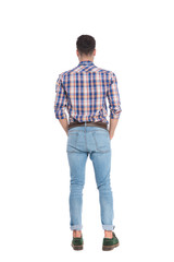 back view of relaxed man wearing shirt with blue checkers