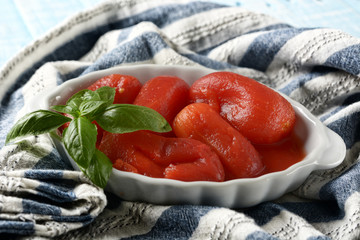 Italian peeled tomatoes in the white bowl