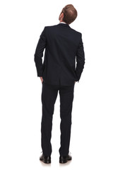 back view of relaxed businessman looking up to side