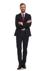 Obraz na płótnie Canvas confident businessman standing on white background with arms folded