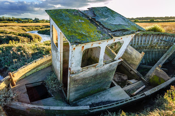 Old boat wreck abandoned in marshland