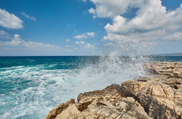 Big waves break about the Rocky Peninsula of Cape Lara in southern Akamas
