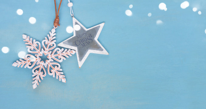 Blue and white christmas with stars on blue wooden background banner