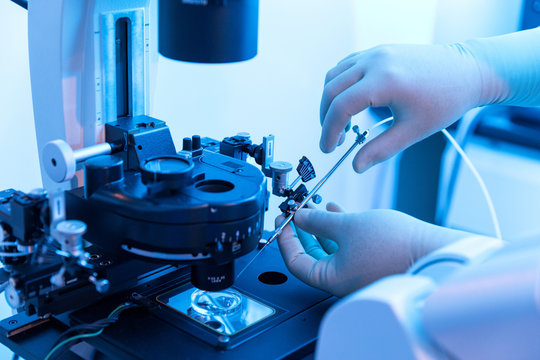 Man Technician working with laboratory equipment
