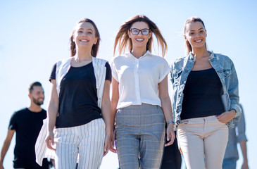 group of friends walking together and looking at their future