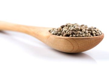 Cannabis Hemp seeds in spoon on white