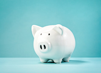 Christmas finances piggy bank wearing santa hat