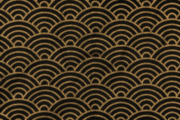Highly detailed all over background texture of traditional japanese black and gold rainbow-shaped pattern design textile in synthetic fabric.