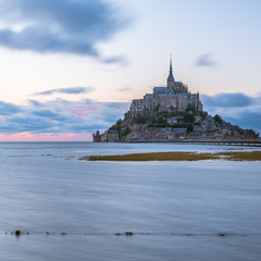Fototapeta na wymiar Sunset at Le Mont Saint Michelle in summer at high tide
