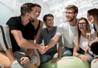 young designers shaking hands with each other