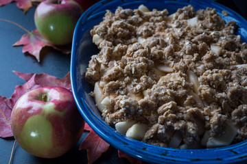 Apple crisp in a pan with topping