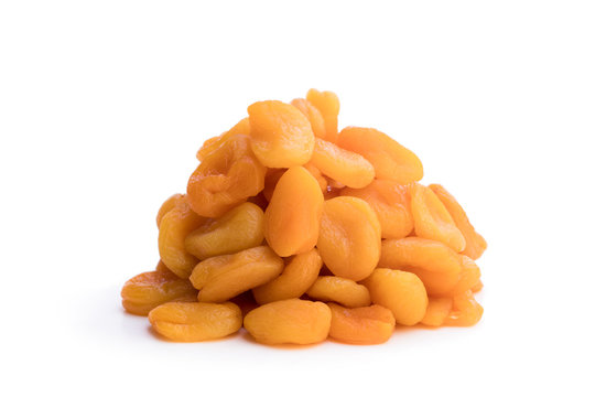 Heap  of dried apricots isolated on white