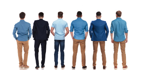 back view of six relaxed young men standing