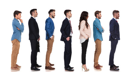 group of seven people with different reactions waiting in line