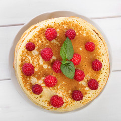 Top view to pancakes with berries