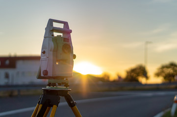 Surveyor equipment (theodolit or total positioning station) on the construction site of the...