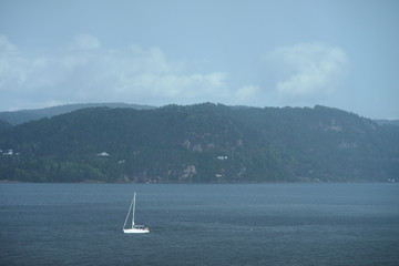 Small white sail yacht.