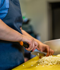 Cutted Onions on  the Yellow Cutting Board
