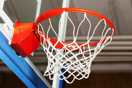 Adidas Basketball ball hitting basket in gym