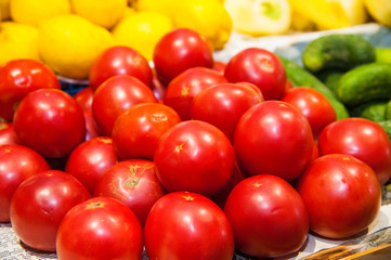 Fresh ripe tomatoes in a box for sale in the grocery shop