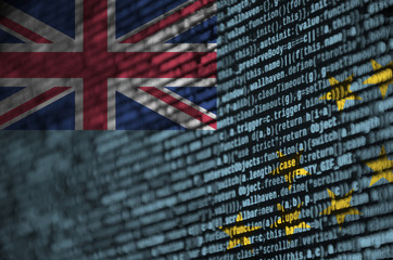 Tuvalu flag  is depicted on the screen with the program code. The concept of modern technology and...