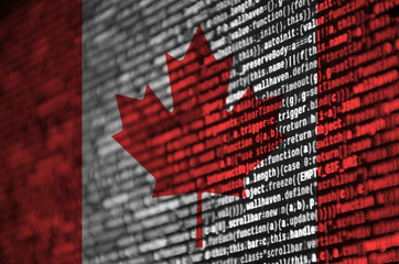 Canada flag  is depicted on the screen with the program code. The concept of modern technology and...