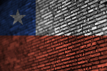 Chile flag  is depicted on the screen with the program code. The concept of modern technology and...