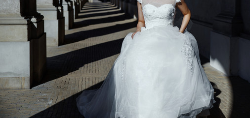 young asian bride running next to