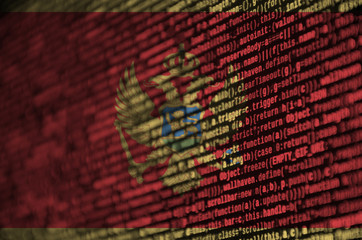 Montenegro flag  is depicted on the screen with the program code. The concept of modern technology...