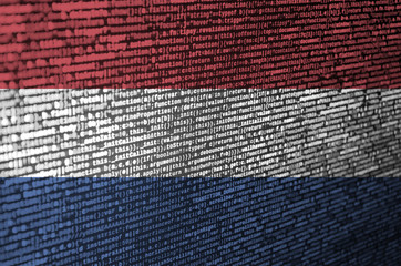 Netherlands flag  is depicted on the screen with the program code. The concept of modern technology...