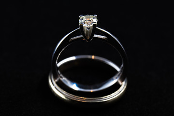 marriage diamond ring on black background