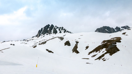 Fototapeta na wymiar High mountain scenery with distant ski lifts in Ischgl, Austria