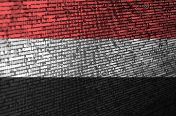 Yemen flag  is depicted on the screen with the program code. The concept of modern technology and...